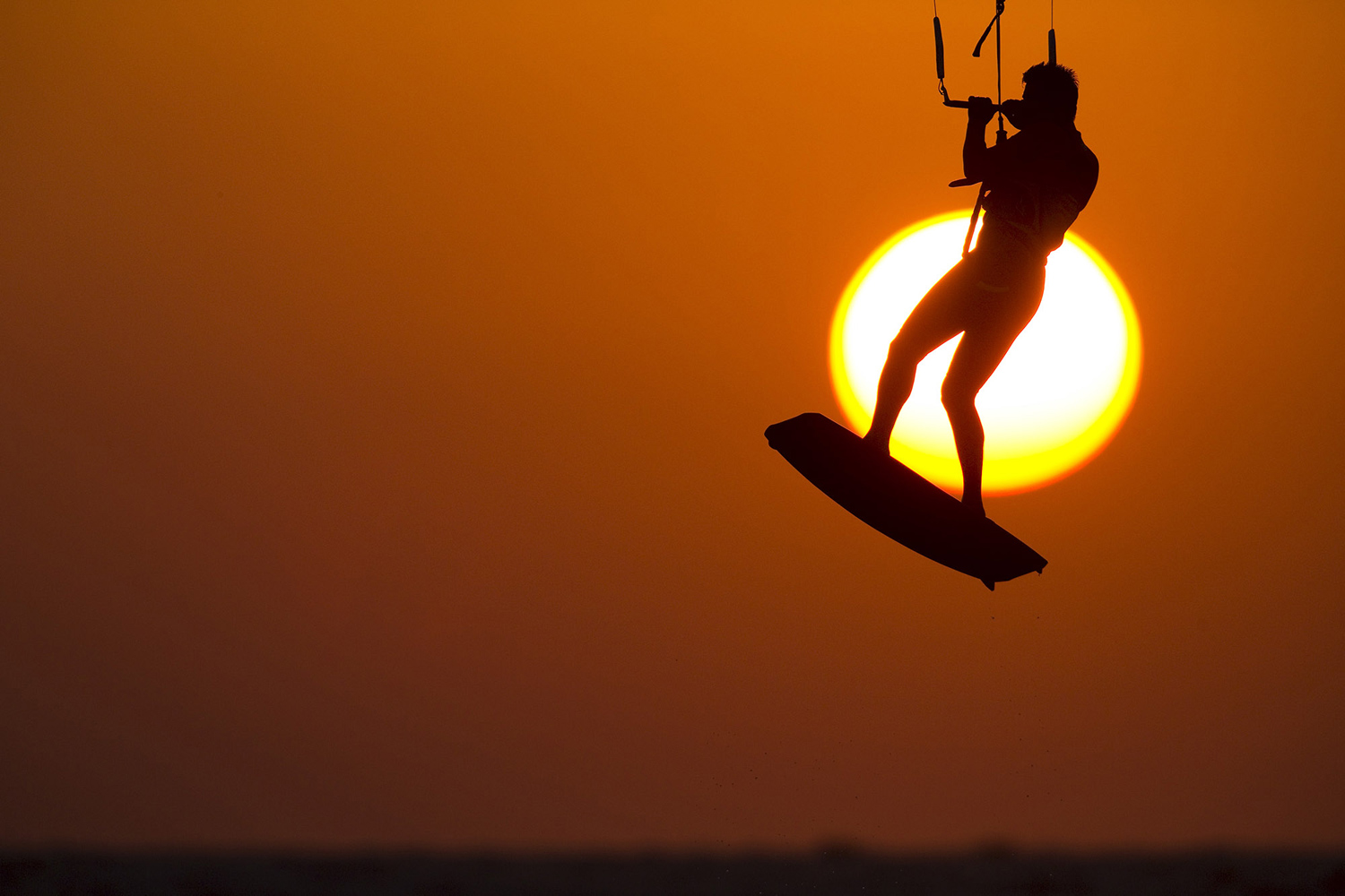 A man kitesurfs in the Mediterranean sea at the southern Israeli city of Ashkelon