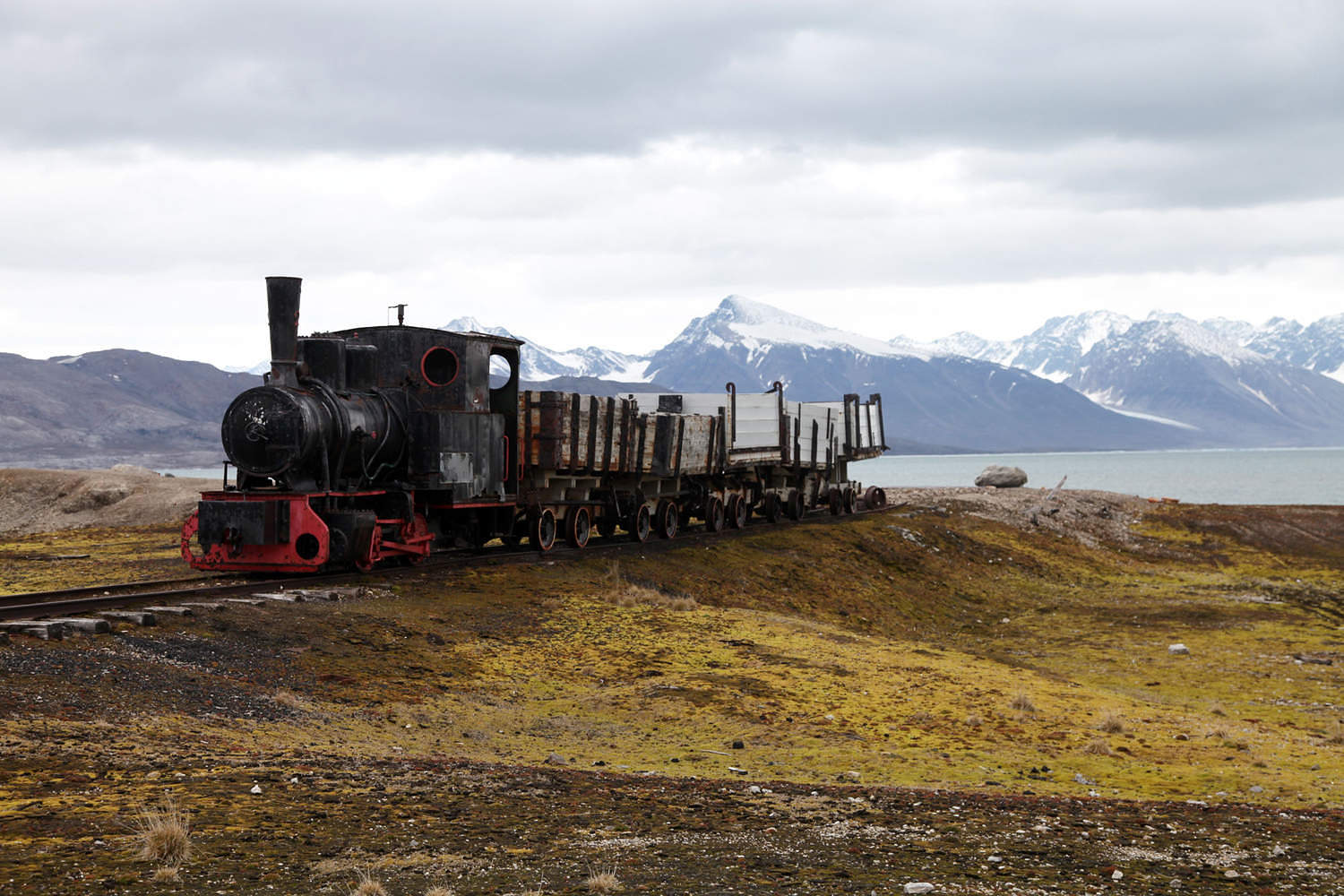Coal trucks and locomotive preserved as a monument at Ny Alesund, Svalbard, Norway, Scandinavia, Europe