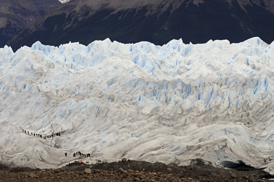 people-walking-on-glacier